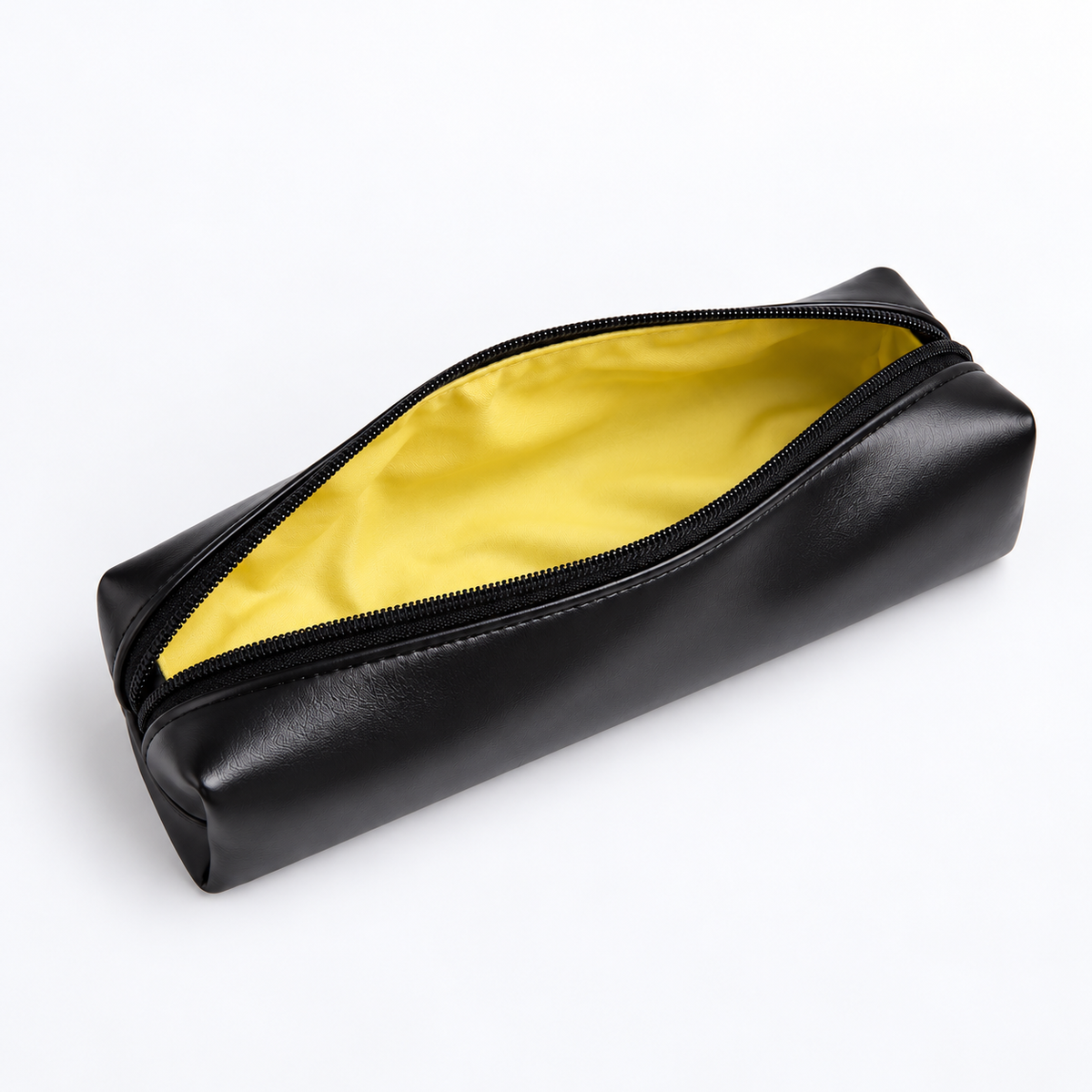 Open black actpacker pencil case showing yellow interior lining